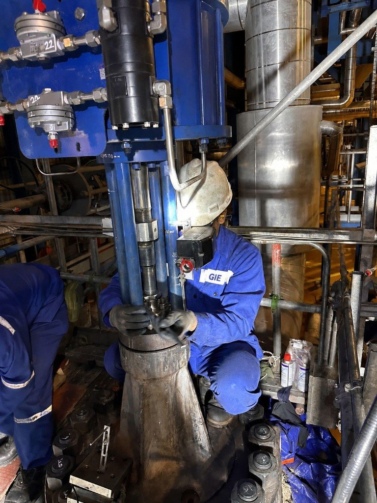 GIE technician servicing a control valve actuator at an industrial plant