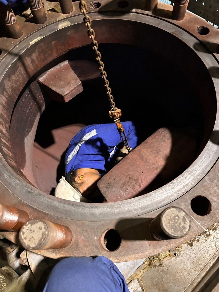 GIE technician servicing a 72 inch check valve on-site
