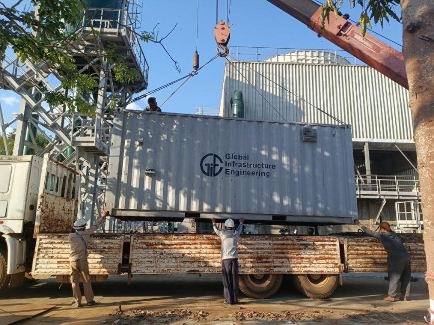 GIE mobile container being transported to site by crane